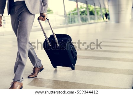 Businessman Hold Luggage Business Trip Royalty-Free Stock Photo #559344412
