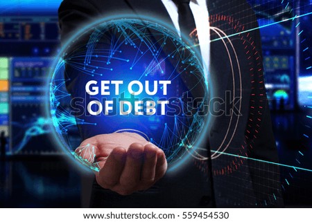Business, Technology, Internet and network concept. Young businessman working in the field of the future, he sees the inscription: get out of debt 
