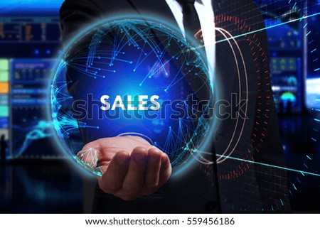 Business, Technology, Internet and network concept. Young businessman working in the field of the future, he sees the inscription: sales 