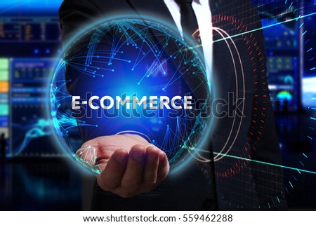 Business, Technology, Internet and network concept. Young businessman working in the field of the future, he sees the inscription: e-commerce 