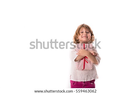 funny child girl with a gift in pink , isolate on a white background