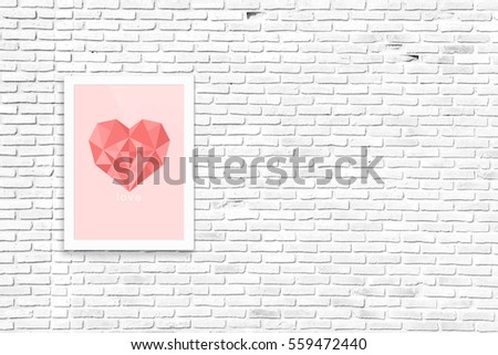 picture frame on brick wall background. Symbol of love on brick wall.