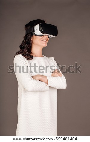 Woman with glasses of virtual reality. VR headset glasses device. Future technology concept.