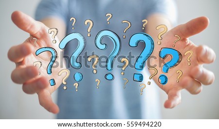 Businessman on blurred background holding hand drawn question marks in his hand Royalty-Free Stock Photo #559494220