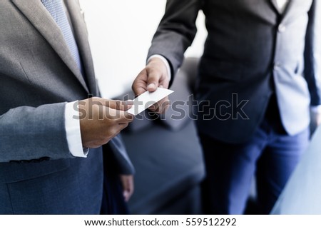business executive exchanging business card