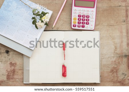 notebook monthly planner record for financial on table