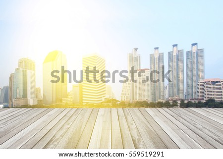 Empty wood floor surface with modern city.