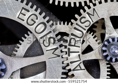 Macro photo of tooth wheel mechanism with imprinted EGOISM, ALTRUISM concept words Royalty-Free Stock Photo #559521754