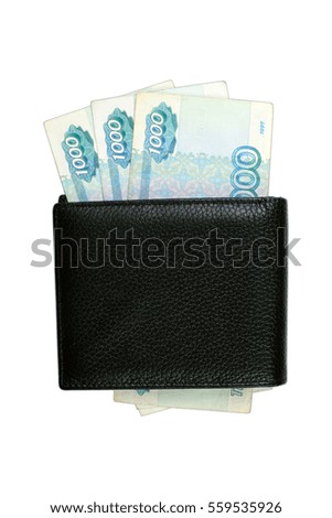 russian banknotes in black leather wallet on a white background
