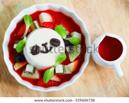 Pannacotta dessert with strawberry jelly on the table, Holiday food concept. 