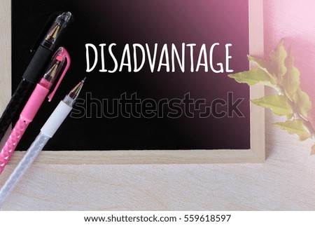DISADVANTAGE - positive word on blackboard concept with pen and green leaf on wooden background