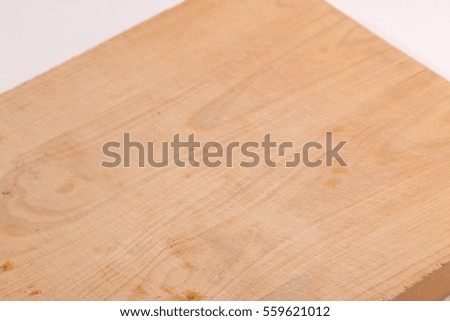 wooden cutting board with crumbs and honey