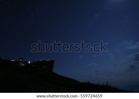 Pu Si Pa at night time where the stars and sky meet the earth.  Royalty-Free Stock Photo #559724659