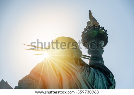 New York; statue of liberty in the sunset Royalty-Free Stock Photo #559730968