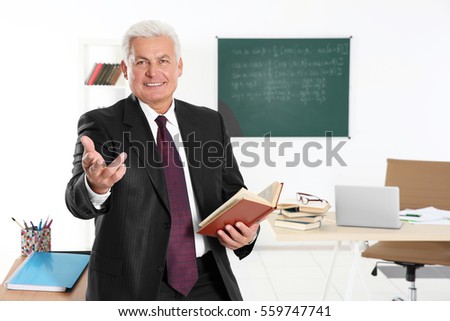 Senior teacher at lesson in classroom