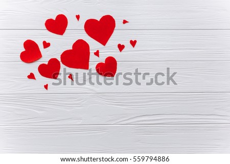 Heart of felt on Wooden white background .The concept of Valentine Day. Royalty-Free Stock Photo #559794886