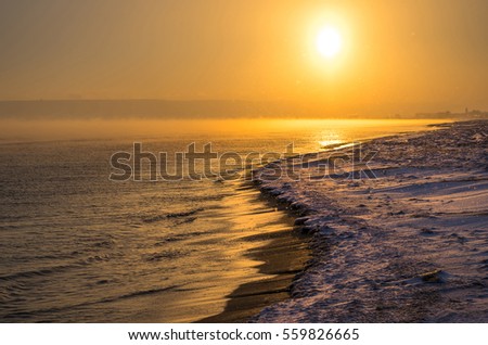 Winter sea at sunset
