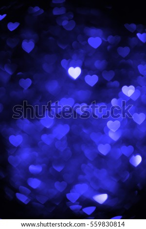 Blue color heart bokeh background photo. Abstract holiday, celebration backdrop.