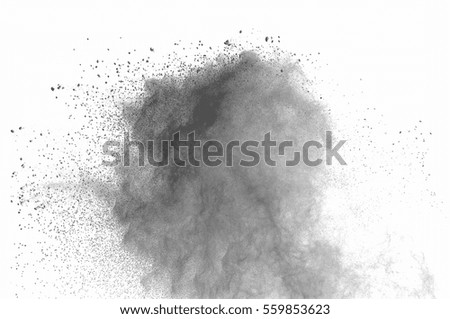 Abstract freeze motion of black dust explosion on white background. Stopping the movement of dark powder on white background. Explosive powder black on white background.