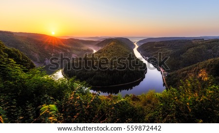 The Saar is a river in northeastern France and western Germany, and a right tributary of the Moselle. Royalty-Free Stock Photo #559872442