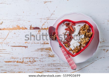 valentine's day breakfast - granola with yogurt, goji berries and coconut, copy space