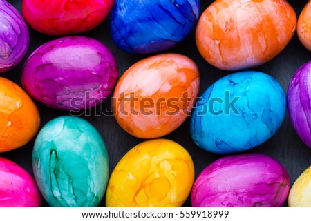 Easter eggs painted in colors on a pattern background.