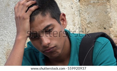 Confused And Worried Teen Male Student Royalty-Free Stock Photo #559920937