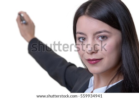 business woman with a marker pen writing something behind her