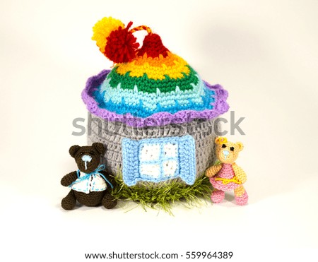 Knitted Bear and a fabulous house with a bright roof. Amigurumi. Gift