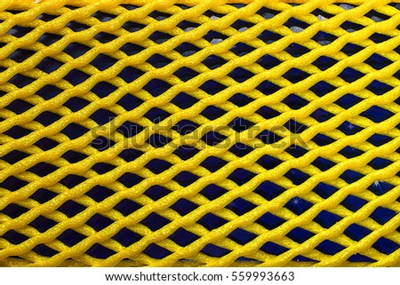Background of yellow grid on dark blue ground