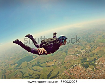 Skydiver freedom concept vintage color Royalty-Free Stock Photo #560032078