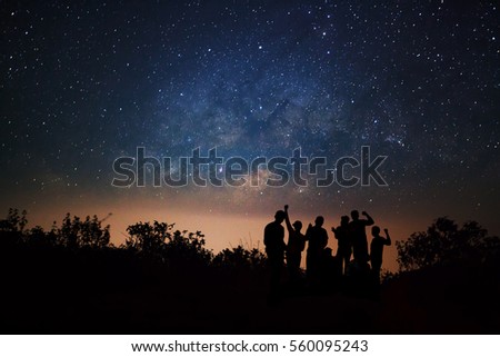Landscape with milky way, Night sky with stars and silhouette of happy people standing on Doi Luang Chiang Dao high mountain in Chiang Mai Province, Thailand.