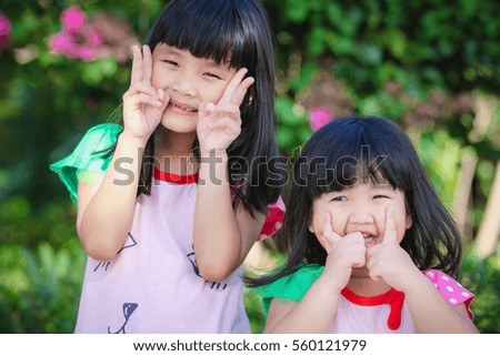 Two sisters smiling brightly , asia girl , Outdoor portrait.