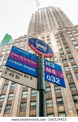 Bus stop against tall buildings, New York City.
