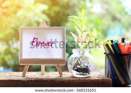 Forever - concept of beautiful words on the canvas with natural background