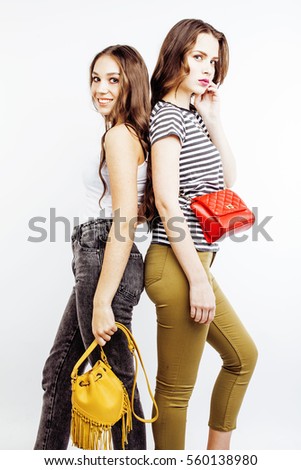 two best friends teenage girls together having fun, posing emotional on white background, besties happy smiling, lifestyle people concept
