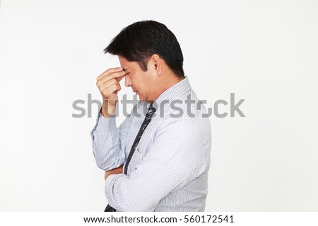 Businessman having a headache 