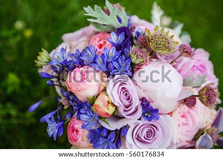 Bridal bouquet of roses and peonies