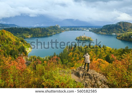 Photographer takes a picture near Bled lake.Slovenia