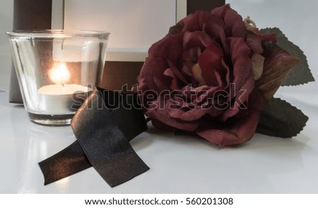  frame, flowers, black ribbons, candles, for mourning
