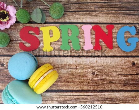 Rustic spring wooden letters with marshmallows on wooden background. 