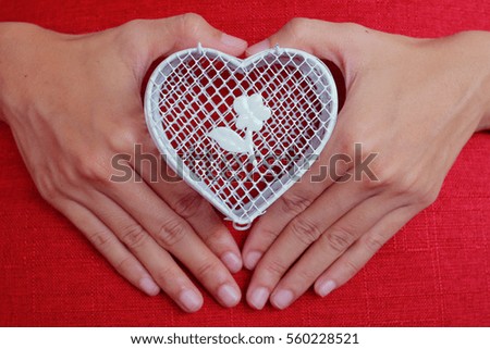 Heart-shaped box with a red background color white symbolizes Valentine.
