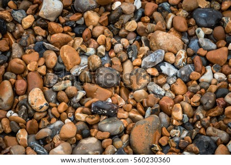 Picture of a pile of peebles on the ground on the beach