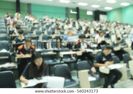 Abstract blur background of student during study or quiz, test and exams from teacher or in large lecture room / University classroom.
