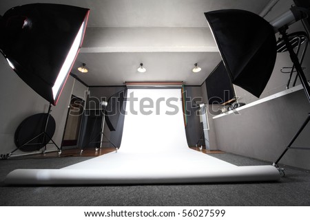 interior of professional photo studio with white background general view