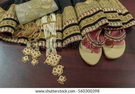 Ethnic wear of women on a wooden table.