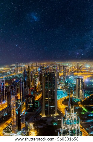 Dubai night aerial cityscape view with starry sky