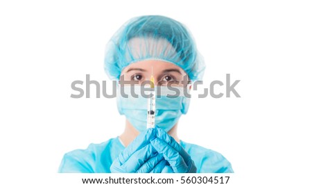 
Nurse or doctor wearing surgical wardrobe holding a syringe with needle isolated on white background