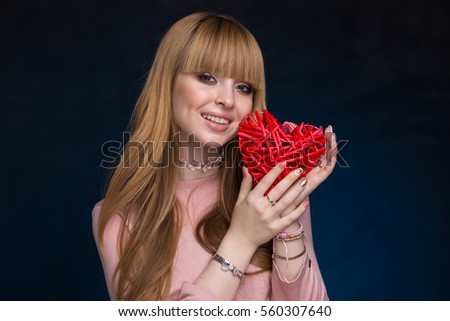 the girl in black and blue textured background with the straw red heart