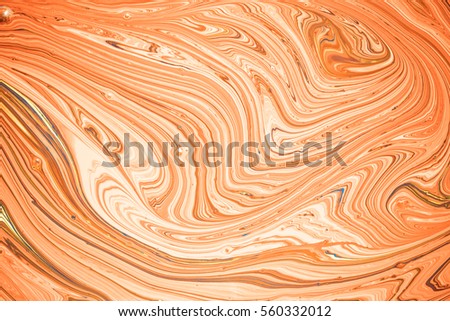 close up of different color oil paint.  Oil paints tone orange abstract background.